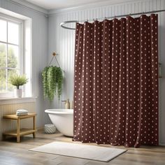 a bath room with a tub and a shower curtain