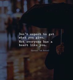 a person holding an umbrella with the words don't expect to get what you give not everyone has a heart like you