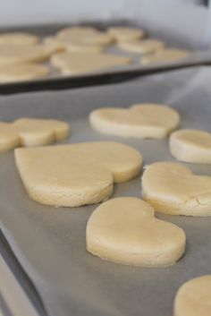 some cookies that are on top of a baking sheet in the oven and ready to go into the oven