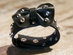 leather bracelet with central bow, covered with studs. total length 21, first closure at 18, depending on 20 www.etniko.it info@etniko.it fb,ig,ebay : ethnickobycrosato 0039 3338778241 Party Leather Bracelet With Rivets, Bow Bracelet, Indian Necklace, African Masks, Star Studs, Cuff Bracelets, Leather Bracelet, Handmade Items, Cuff