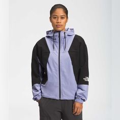 Color Sweet Lavender Two-Tone Colorblocking Lends Dimensional Visuals To This Jacket. Attached Drawstring Hood Long Sleeves Elasticized Cuffs Zip Front Bungee Cord Hem Nylon Machine Wash Imported Size & Fit About 24.5" From Shoulder To Hem Wind Jacket, Women's Jackets, The North Face Jackets, North Face Jackets, Winter Coats Women, North Face Women, North Face Jacket, Winter Women, Puma Jacket