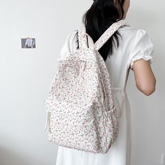 Why You'll Love It Introducing a floral symphony in canvas, a backpack where elegance meets utility. Blossoms bloom upon sturdy fabric, embodying nature's beauty and purpose. Explore its functional pockets, carrying the essence of gardens wherever you wander. Whether city streets or country paths, let the floral charm and practicality accompany your journey. Walk amidst petals and possibilities, as this canvas backpack transforms every outing into a graceful adventure. Features Material: Nylon, White Backpack For Daily Use In Spring, Spring White Backpack For Daily Use, Spring Floral Print Casual Backpack, White Backpack For Everyday Use In Spring, Floral Print Backpack For School In Spring, Floral Print Standard Backpack For Daily Use, White Everyday Backpack For Spring, Daily Use Floral Print Backpack, Spring School Bags In Fabric