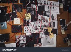 a bulletin board covered in lots of pictures and magnets with red string attached to it