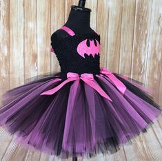 FREE SHIPPING on all orders within the US, no coupon code needed! Batman Tutu by Little Ladybug Tutus. Handmade Tutus for girls specializing in birthday party dresses, Halloween costumes, flower girl dresses, pageant tutus, 1st birthday tutus, and blinged Converse sneakers. We accept custom orders! ORDER PRODUCTION TIME Please check the top of our website main page for current turn around time. Since all items are handmade at the time of purchase, there is a production time that varies. We do no Playful Halloween Party Tutu Dress, Cute Purple Tutu Dress For First Birthday, Purple Cute Tutu Dress For First Birthday, Pink Tutu Dress For Carnival Party, Fun Fitted Tutu Dress For Party, Whimsical Tutu Dress For Halloween Party, Pink Halloween Tutu Party Dress, Whimsical Halloween Tutu Party Dress, Pink Tutu Dress For Halloween Party