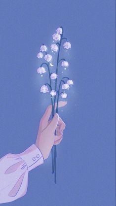 a hand holding a bunch of white flowers against a blue sky with the word love written on it