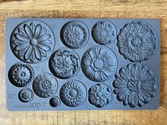 a cookie sheet with many different flowers on it's side and numbers in the middle