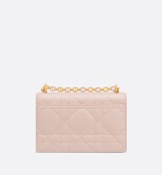 The Miss Caro mini bag enhances the Dior Caro line with modern and timeless elegance. Crafted in powder pink lambskin, it stands out with the unique quilted effect of Macrocannage stitching, as well as a flap accented by a gold-finish metal CD twist clasp inspired by the seal of a Christian Dior perfume bottle. Alternating between gold-finish metal links and tonal enamel links that match the leather, the adjustable chain shoulder strap has a leather insert for added comfort when carrying the bag Elegant Quilted Pink Bag, Elegant Pink Quilted Shoulder Bag, Caro Line, Dior Perfume Bottle, Dior Caro, Christian Dior Perfume, Dior Star, Dior Perfume, Icon Shoes