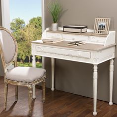 a white desk with a chair next to it