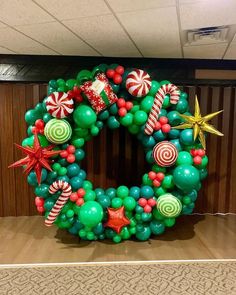 a wreath made out of balloons and candy canes