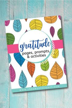 a book with colorful leaves on it and the title, gratitude pages, prompts & activities