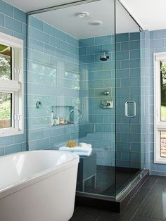 a bath room with a tub and a window