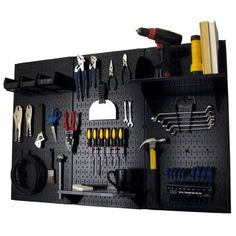 a pegboard with tools hanging on it