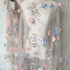 a white dress with flowers on it