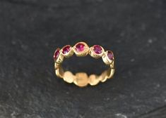 Gold Ruby Ring set with a Created Ruby in a perfect diamond cut & bright red color with perfect clarity, at 3mm diameter each, 1 Carat combined.Gold Bubble Band made of Gold Vermeil ☞ thickest 18k Gold Plating on top of Solid 925 Sterling Silver ☞ made to last.☞ Choose your size ☞ I resize (before shipping) for FREE to Any size*Matching Pendant & Matching Earrings - please ask me⌛Last Ring left ⌛Details : ♥ Each item comes in a cute GIFT BOX ✓ ♥ GUARANTEE on the materials ✓♥ Created Ruby Ruby Ring Set, Green Diamond Rings, Gold Ruby Ring, July Birthstone Ring, Ruby Bands, Gold Bubbles, Ruby Ring Gold, Green Emerald Ring, Emerald Ring Gold