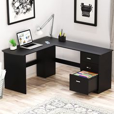 a desk with two drawers and a laptop on it