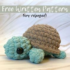 a small crocheted turtle sitting on top of a white surface with the text free written pattern