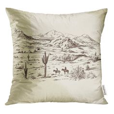 a pillow with a drawing of a desert scene on it