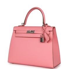 This Kelly, in the Sellier style, is in Rose Confetti epsom leather with palladium hardware and has tonal stitching, two front straps with toggle closure, clochette with lock and two keys, single rolled handle and removable shoulder strap.The interior is lined with Rose Confetti chevre leather and has one zip pocket with an Hermes engraved pull and one open pocket on the opposite side.Collection: YOrigin: FranceCondition: New and never worn (plastic on hardware)Accompanied by: Hermes box, dustbag, clochette, lock, two keys, shoulder strap, clochette dustbag, shoulder strap dustbag, felt, rainhat, carebook, ribbonMeasurements: 9.8" width x 7.5" height x 3.5" depth; 3.5" handle drop (16.5" shoulder strap drop) Rose Confetti, Hermes Kelly Sellier, Kelly Sellier, Hermes Box, Hermes Bags, Brunei, Confetti, Zip Pockets, New Zealand