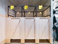 the inside of a clothing store with wooden doors