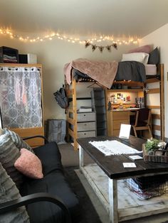 a living room filled with furniture and lots of clutter on top of the table