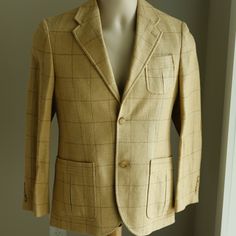 This Ralph Lauren Designer Boy's Windowpane Tweed Sport Coat/Blazer Is Pure Luxury! Your Boy Will Look Debonair In This One! The Coat Is Made Of A Fine Linen/Silk Blend And Is Done In A Windowpane Tweed In Shades Of Tan And Brown. It Has A Notched Lapel, Single Breasted 3-Button Closure (Top Button Not Buttoned In Main Image), 2 Functional Pockets With Pocket Pleats, A Chest Pocket With The Same Detailed Pocket Pleat, 2 Interior Pockets, A Back Vent. This Coat Also Sports Bi-Swing Gussets (Not Only For Style, But Easy Movement)And A Belted Back. The Style On This One Is Incredible! The Elbows Have Suede Patches And The Cuffs Have 4 Buttons. It Is Fully Lined And Has A Preppy Striped Lining I Boys Blazer, Tweed Sport Coat, Ralph Lauren Linen, Designer Boys, Fine Linen, Kids Jacket, Sport Coat, Chest Pocket, Single Breasted