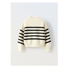 Knit sweater with mock neck and long sleeves.