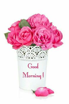 pink roses in a white vase with the words good morning on it and a doily