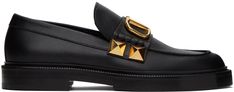 Grained calfskin loafers in black. · Moc toe · Strap and logo hardware at vamp · Signature pyramid studs at sides · Stacked leather block heel with rubber injection · Leather sole with rubber injection · Heel: H1 Supplier color: Nero Formal Leather Loafers With Studs, Formal Leather Studded Loafers, Formal Studded Leather Loafers, Luxury Leather Loafers With Studs, Luxury Studded Loafers For Formal Occasions, Luxury Business Loafers With Studded Rubber Outsoles, Luxury Studded Loafers For Business, Studded Loafers, Valentino Black