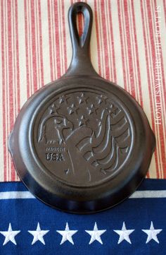 a frying pan sitting on top of a blue and white tablecloth with stars