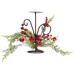 a candle holder decorated with red berries and greenery