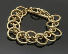 "925 Sterling Silver - Vintage Gold Plated Circle Link Chain Bracelet - BT8326  925 Sterling Silver - Vintage Gold Plated Circle Link Chain Bracelet - BT8326  Jewelry Type:         Bracelet  Metal Type:            925 Silver  Metal Size:             8.5\" Length  .75\" Height   Stone Type:            N/A  Condition:              N/A  Jewelry Weight:     24.7 Grams  PLEASE NOTE: THIS ITEM IS PRE-OWNED. ALTHOUGH MOST ITEMS ARE IN VERY GOOD CONDITION, SOME MAY NEED CLEANING AND/OR MINOR REPAIRS. WE MAKE A VERY STRONG EFFORT TO UPLOAD CLEAR PICTURES. PLEASE INSPECT ALL PICTURES AND ASK ALL QUESTIONS YOU MAY HAVE PRIOR TO MAKING A PURCHASE. NOT ALL STONES ARE GENUINE, SOME ARE ENHANCED OR CREATED." Elegant Link Bracelets With Jump Ring, Elegant Chain Link Bracelets With Jump Ring, Clear Pictures, Bracelet Metal, Link Chain Bracelet, Metal Bracelets, Link Chain, Chain Bracelet, Vintage Gold