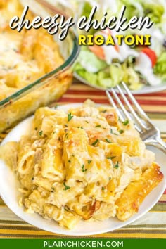 a white plate topped with chicken and rice casserole next to a bowl of salad