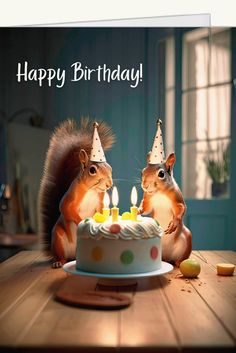 two squirrels are sitting in front of a birthday cake