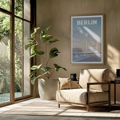 a living room filled with furniture and a plant in front of a large glass window