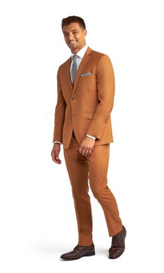 A slim caramel suit with two buttons and a notch lapel. Brown Slim Fit Three-piece Suit With Suit Collar, Slim Fit Brown Three-piece Business Suit, Brown Slim Fit Three-piece Suit, Elegant Slim Fit Brown Blazer, Brown Slim Fit Blazer For Office, Fitted Brown Three-piece Suit For Office, Classic Brown Three-piece Suit, Slim Fit, Classic Brown Slim Fit Three-piece Suit, Brown Slim Fit Suit For Office