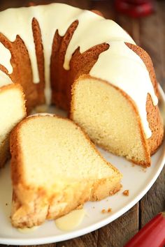 a bundt cake with white icing on a plate