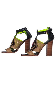 Go funky and fab in a flash with these standout pumps from Coach! Created with a unique woven design and pop of lime green on the interior, these block heeled beauties are the perfect statement shoe for summer. Whether you’re off to an outdoor wedding or going to brunch by the beach, pair these stunners with a colorful mini dress and straw bag and you’ll be good to go! Size 7.5 Leather upper w/ woven design Lime green interior Ankle strap closure Open toe Tall block heel Leather sole and footbed Modern Green Heels With Stacked Heel, Designer Green Block Heels, Coach Block Heel Heels For Spring, Coach Block Heel Spring Heels, Green Ankle Strap Heels With Wooden Heel, French Girl Chic, Block Heel Pumps, Green Interior, Statement Shoe