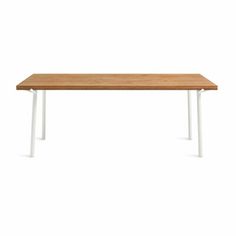 a wooden table with white legs on a white background