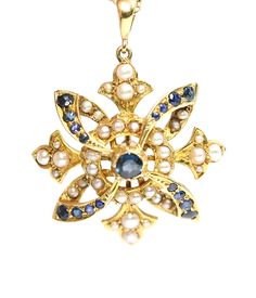 A stunning Edwardian 15ct gold Sapphire and Pearl pendant in excellent condition  Stamped 15C this has been professionally cleaned but left unpolished so as not to remove the antique patina  In Britain, or England and the British Isles, the use of 15k (usually marked 15ct) was utilized for a number of years.   From the year 1854 to 1931, you may find gold jewelry testing at or hallmarked with either 15ct or 625.  The pendant measures 28mm in diameter with a 6mm bale and weighs 6gms Free internat Antique Hallmarked Yellow Gold Jewelry, Ornate 14k Stamped Ceremonial Jewelry, Ceremonial 14k Stamped Pendant Jewelry, Ornate 14k Stamped Jewelry For Ceremonial Occasions, Antique White Gold Pearl Pendant Jewelry, Antique White Gold Jewelry With Pearl Pendant, Ornate Pearl Pendant Jewelry, Ornate Yellow Gold Pendant Jewelry, Ornate 14k Gold Medallion Jewelry