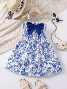 Young Girls' Bowknot Decor Flower Printed Spaghetti Strap Dress Blue and White Cute  Sleeveless Woven Fabric Floral,All Over Print Cami Non-Stretch  Young Girls Clothing, size features are:Bust: ,Length: ,Sleeve Length: Kids White Dress, Slim Fit Top, Spaghetti Strap Dress, Fabric Floral, Vacation Dresses, Strap Dress, Spaghetti Strap Dresses, Girls Clothing, Dress Blue