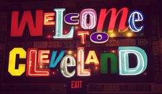 a neon sign that says welcome to cleveland