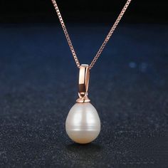 A luminous white pearl with a ridged sterling silver cap setting (gold setting available) is suspended from a smooth box chain. At 17 inches in length, this pearl pendant offers a modern and elegant look. It is also a perfect choice for a wedding bridal pendant. Pendant Necklaces For Women | Freshwater Pearl Drop Pendant Finish off any outfit with a gorgeous handmade Freshwater pearl necklace from Huge Tomato. With a wide online collection of striking vintage-inspired necklace designs, lovingly Single Pearl Pendant, Pearl Drop Pendant, Bridal Pendant, Pearl Bridal Jewelry, Pearl Jewelry Wedding, White Pearl Necklace, White Freshwater Pearl, Sterling Silver Necklace Pendants, Freshwater Pearl Necklaces