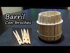 a wooden basket sitting on top of a table next to scissors