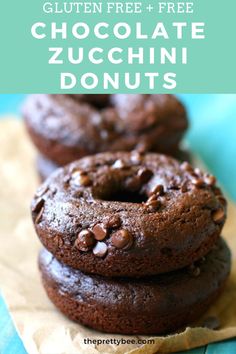 chocolate zucchini donuts stacked on top of each other with text overlay