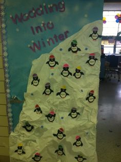 a bulletin board with penguins on it