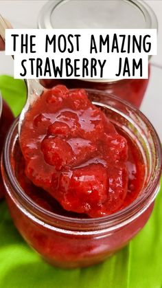 a jar filled with jam sitting on top of a green cloth