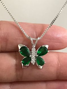 Sterling Silver Emerald CZ Butterfly Necklace Emerald is the birthstone for May. This makes a perfect gift for those loved ones born in May. Metal: All components are made from solid .925 Sterling Silver Stone: Cubic Zirconia Measurement: pendant height is 18mm including bail and 17mm at widest part Choose Chain Length At Checkout You can find other CZ and Birthstone Jewelry in my shop here https://www.etsy.com/shop/LinksAndStones?ref=seller-platform-mcnav&section_id=24399452 Please feel fre Silver Green Jewelry, Green Butterfly Necklace, Green And Silver Jewellery, Emerald Butterfly, Butterfly Necklace Silver, Quinceanera Jewelry, Born In May, Color Verde Claro, Prom Inspo