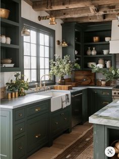 a kitchen with dark green cabinets and white counter tops is featured in this article by interior stylist