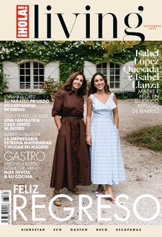 two women standing next to each other in front of a house on the cover of living magazine