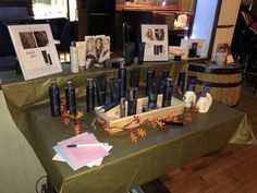 an assortment of personal care products displayed on a table in a room with other items